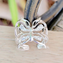 Load image into Gallery viewer, Adjustable butterfly ring on a tan background.  Metal  wire in the background.