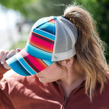 Load image into Gallery viewer, Model is wearing a striped cap and a brown sweatshirt.  View is from the side.  She has a ponytail with brown hair.