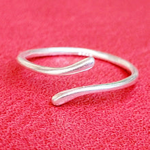 Load image into Gallery viewer, Picture of Geometric Adjustable Sterling Silver Ring on a red background