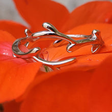 Load image into Gallery viewer, Picture of Leaf Adjustable Sterling Silver Ring on a red flower