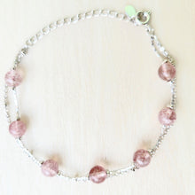 Load image into Gallery viewer, Picture of Double Strand Strawberry Crystal Sterling Silver Bracelet on a tan background