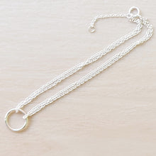 Load image into Gallery viewer, Double Strand Circle Sterling Silver Bracelet on a tan background.
