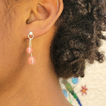 Load image into Gallery viewer, Strawberry Crystal Sterling Silver Dangle Earring on model with short curly brown hair.