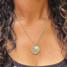 Load image into Gallery viewer, Picture of Kindness Changes Everything Inspirational Necklace on model with a black shirt and curly brown hair