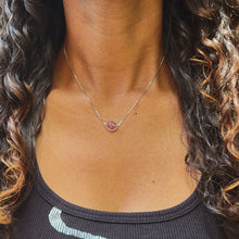Load image into Gallery viewer, Strawberry Ball Sterling Silver Necklace on model with long brown curly hari and a black shirt.
