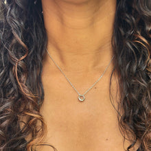 Load image into Gallery viewer, Silver Geometric Charm Necklaces on model with long brown curly hair and a black shirt.