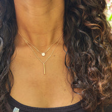 Load image into Gallery viewer, Rose Gold Disc and Bar Necklace on model with brown curly hair and a black shirt.