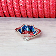 Load image into Gallery viewer,  Picture of Flower Two-toned Adjustable Sterling Silver Ring grey tile with a red textured background