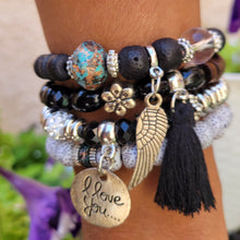Load image into Gallery viewer, Black Tasseled Beaded Layering Bracelet on model's wrist.