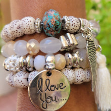Load image into Gallery viewer, Cream Tasseled Beaded Layering Bracelet on model's wrist.