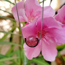 Load image into Gallery viewer, Strawberry Ball Sterling Silver Necklace with pink flowers and leaves in the background.