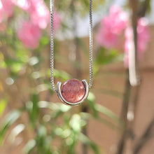 Load image into Gallery viewer, Strawberry Ball Sterling Silver Necklace with pink flowers and leaves in the background.