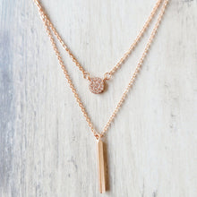 Load image into Gallery viewer, Rose Gold Disc and Bar Necklace with grey background.