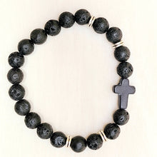 Load image into Gallery viewer, Silver Accent Beaded Cross Bracelet Black on a tan background.