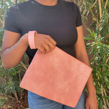 Load image into Gallery viewer, Versatile Oversized Clutch pink on model with black shirt and jeans