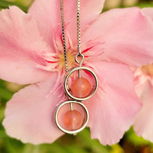 Load image into Gallery viewer, Picture of Box Chain Strawberry Dangle Sterling Silver Earrings with pink flowers in the background.