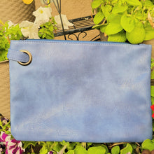 Load image into Gallery viewer, Versatile Oversized Clutch blue on leaves and flowers.