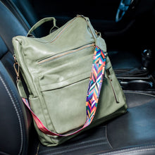 Load image into Gallery viewer, Green convertible bag in a car with black seats