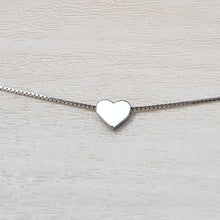 Load image into Gallery viewer, Elegant Heart Sterling Silver Necklace on a tan background. 
