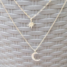 Load image into Gallery viewer, Star and Crescent Moon Double Strand Necklace on a grey background. 
