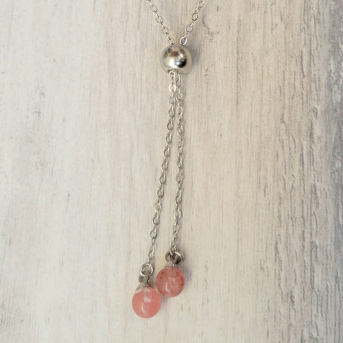 Strawberry Crystal Adjustable Sterling Silver  Necklace on grey background. 