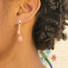 Load image into Gallery viewer, Strawberry Crystal Sterling Silver Dangle Earring on model with short curly brown hair.
