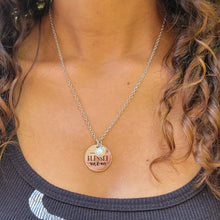 Load image into Gallery viewer, Picture of Blessed Mom Disc and Charm Necklace with white charm on a model with a black shirt and brown curly hair.
