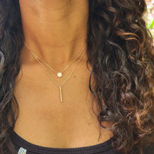 Load image into Gallery viewer, Rose Gold Disc and Bar Necklace on model with brown curly hair and a black shirt.
