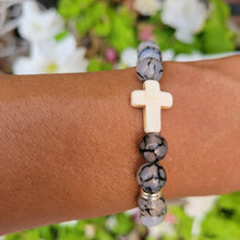 Load image into Gallery viewer, Silver Accent Beaded Cross Bracelet Grey on a wrist.
