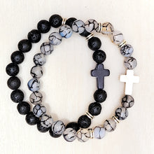 Load image into Gallery viewer, Silver Accent Beaded Cross Bracelets on a tan background. 
