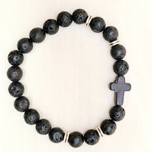 Load image into Gallery viewer, Silver Accent Beaded Cross Bracelet Black on a tan background.
