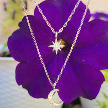 Load image into Gallery viewer, Star and Crescent Moon Double Strand Necklace on a purple flower
