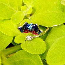 Load image into Gallery viewer, Picture of Flower Two-toned Adjustable Sterling Silver Ring laying in green leaves
