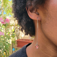 Load image into Gallery viewer, Picture of Box Chain Strawberry Dangle Sterling Silver Earrings on a model in a black shirt and short brown curly hair.  Pink flowers in the background.
