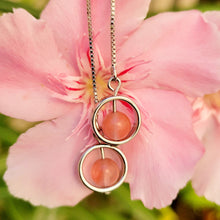 Load image into Gallery viewer, Picture of Box Chain Strawberry Dangle Sterling Silver Earrings with pink flowers in the background. 
