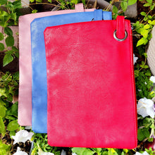 Load image into Gallery viewer, Versatile Oversized Clutch from left to right- pink, blue, red on leaves and white flowers. 
