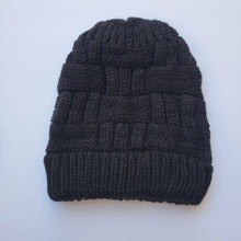 Load image into Gallery viewer, Black Ponytail &amp; Messy Bun Knit Beanie front view on a white background.
