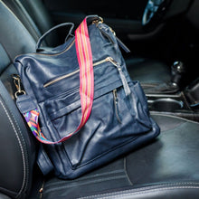 Load image into Gallery viewer, Navy convertible bag in a car with black seats
