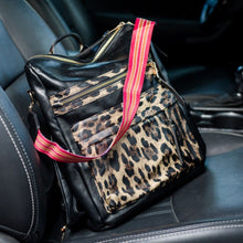Load image into Gallery viewer, Leopard black convertible bag in a car with black seats
