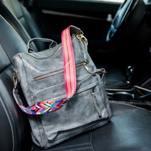 Load image into Gallery viewer, Grey convertible bag in a car with black seats
